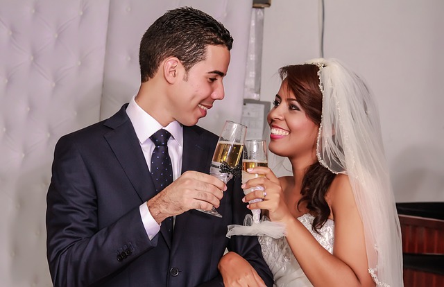 Newlyweds clinking glasses