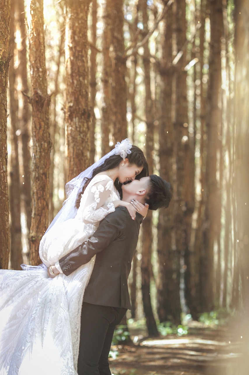 Newlyweds posing in the woods