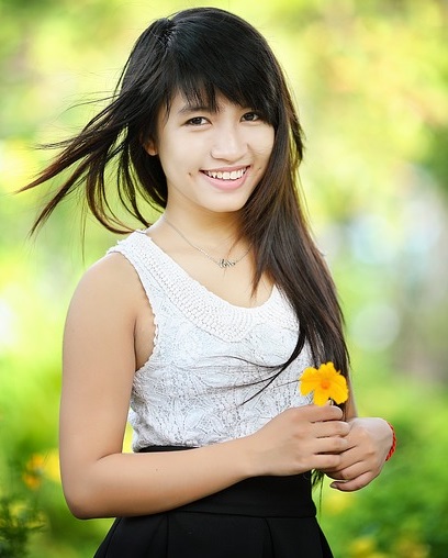 A young woman with a flower