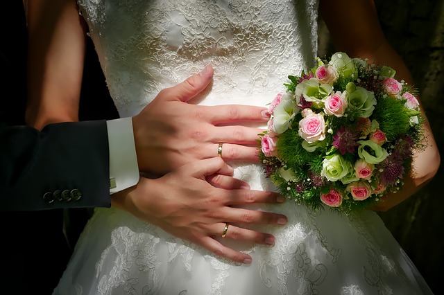 Newlyweds showing rings